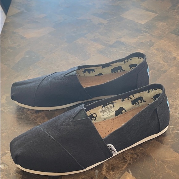 Toms Shoes - TOMS shoes. Black on white.